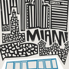Close-up view of the Miami city print showcasing towering black skyscrapers and the city name in playful typography, resting above a clean-lined blue monorail.