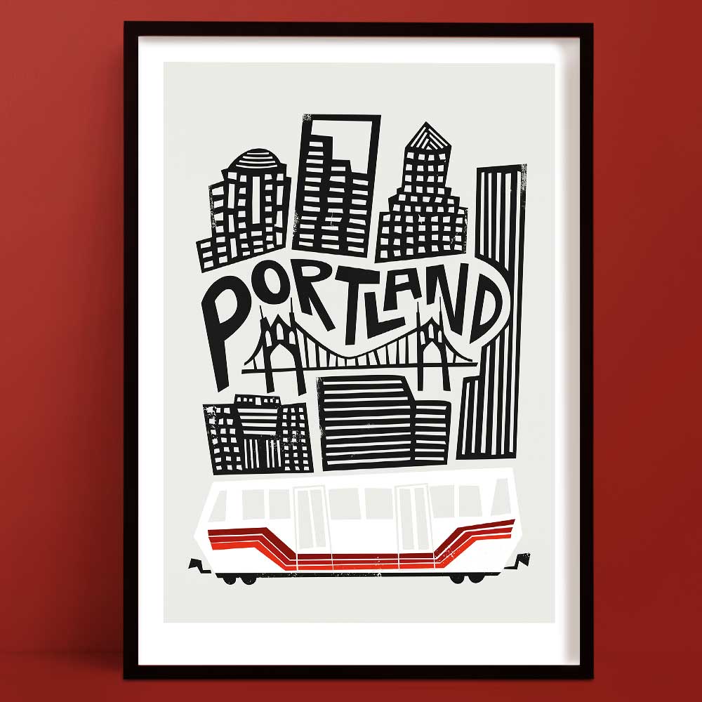 A bold, black and white illustration of Portland’s skyline featuring iconic high-rises and the St. Johns Bridge, with a red and white streetcar below.