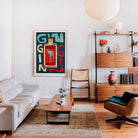 Statement gin print adding a playful touch to a contemporary lounge interior.