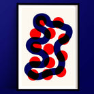 A striking abstract art print titled “River Walk” featuring deep navy blue serpentine curves weaving through bold crimson red circles on a warm white background.
