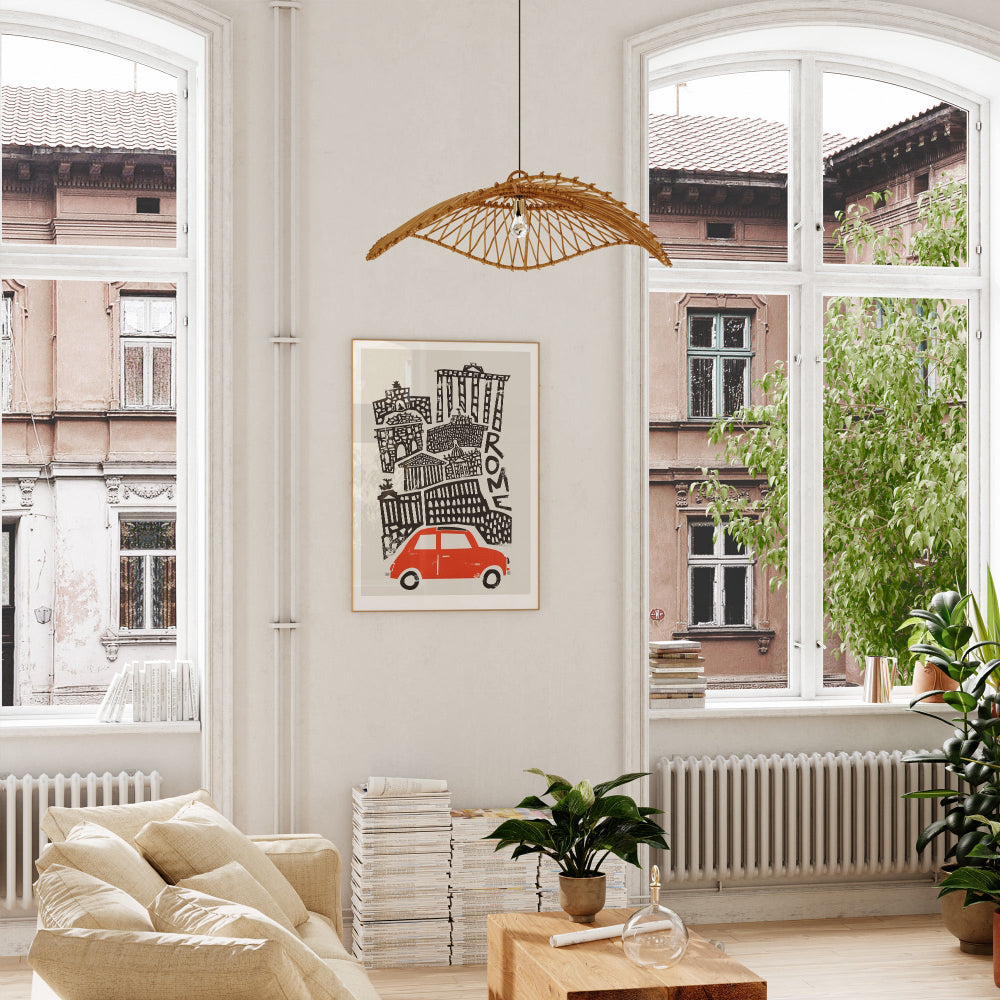 Rome city art displayed in a bright, stylish living space, its playful contrast of old-world structures and classic car energising the neutral decor.
