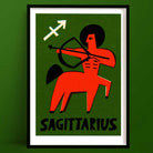 Sagittarius zodiac art print featuring a red centaur archer and white zodiac symbol, framed on deep green background.