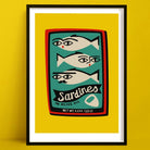 Sardines print featuring illustrated fish with faces inside a red tin, framed on yellow wall.