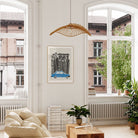 The Singapore city print styled in a bright room with large windows and soft furnishings, adding a modern touch.
