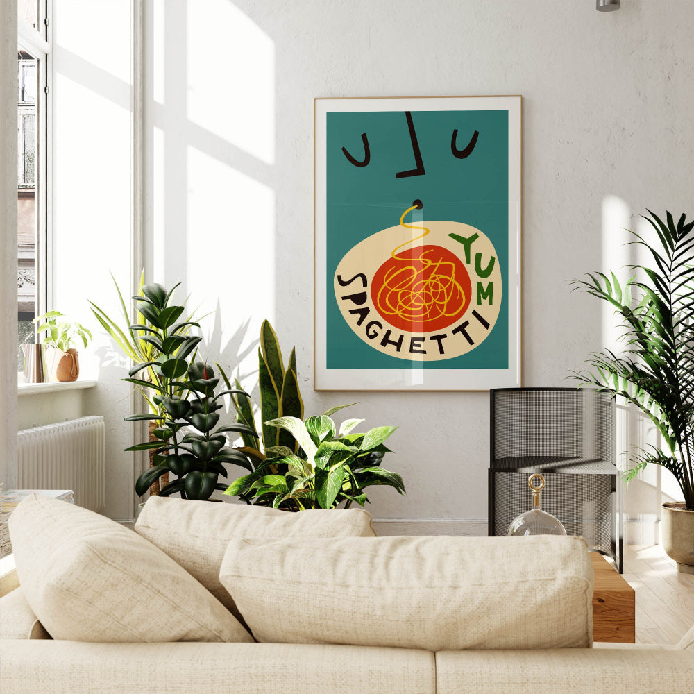 The Spaghetti Yum print on a teal wall in a sunlit living room, adding warmth and personality to the modern furnishings and leafy green decor.