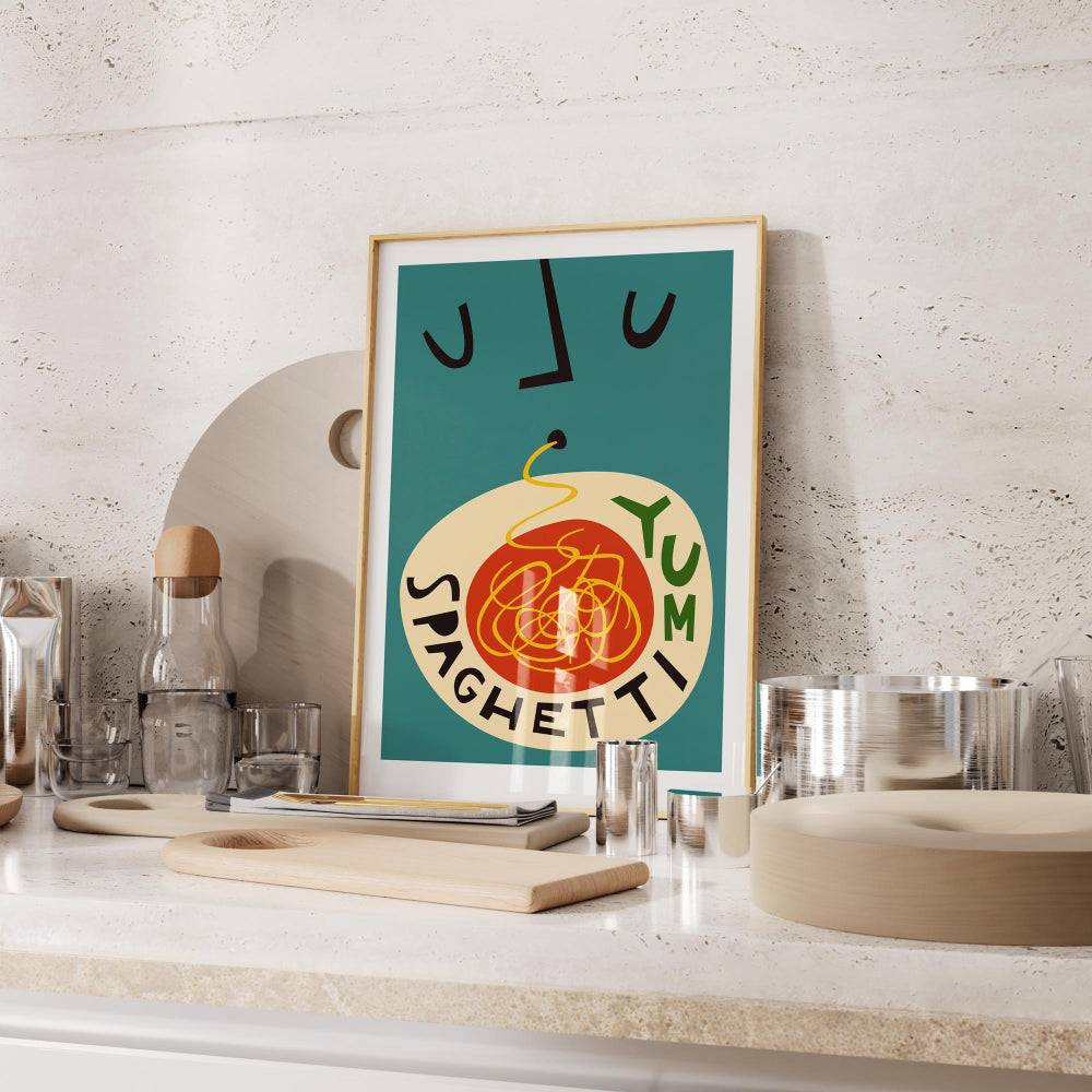 The Spaghetti Yum print perched on a kitchen shelf, bringing a cheeky twist to the space with its rich tomato reds and expressive minimal face lines.