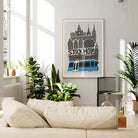 The Stockholm print hanging in a bright, leafy interior with natural light, styled with modern minimalism and a pop of blue.