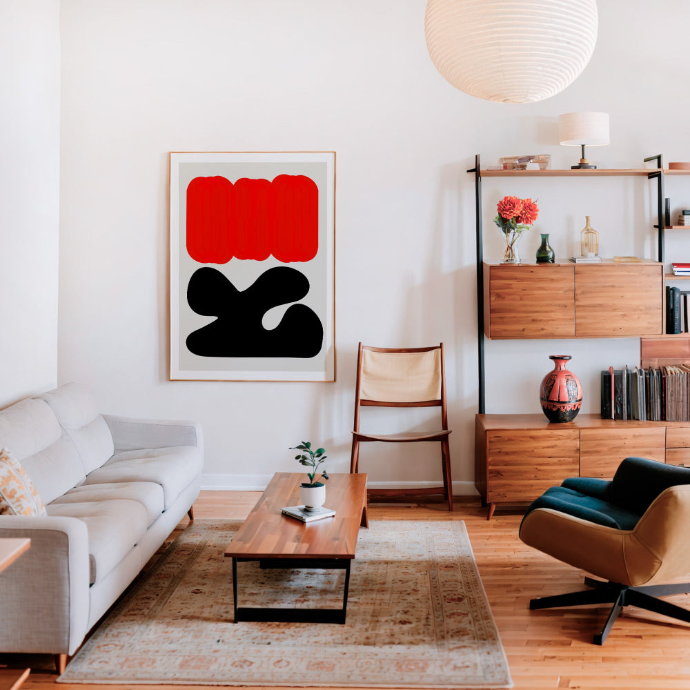 A living room scene with the Sundown print taking centre stage on a red accent wall, its abstract simplicity commanding attention amid cosy, eclectic decor.

