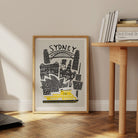 Framed Sydney cityscape poster bringing bold colour to a modern room.