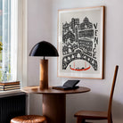 Venice cityscape artwork hanging in a modern reading nook, pairing European romanticism with bold mid-century design energy in a minimalist home.
