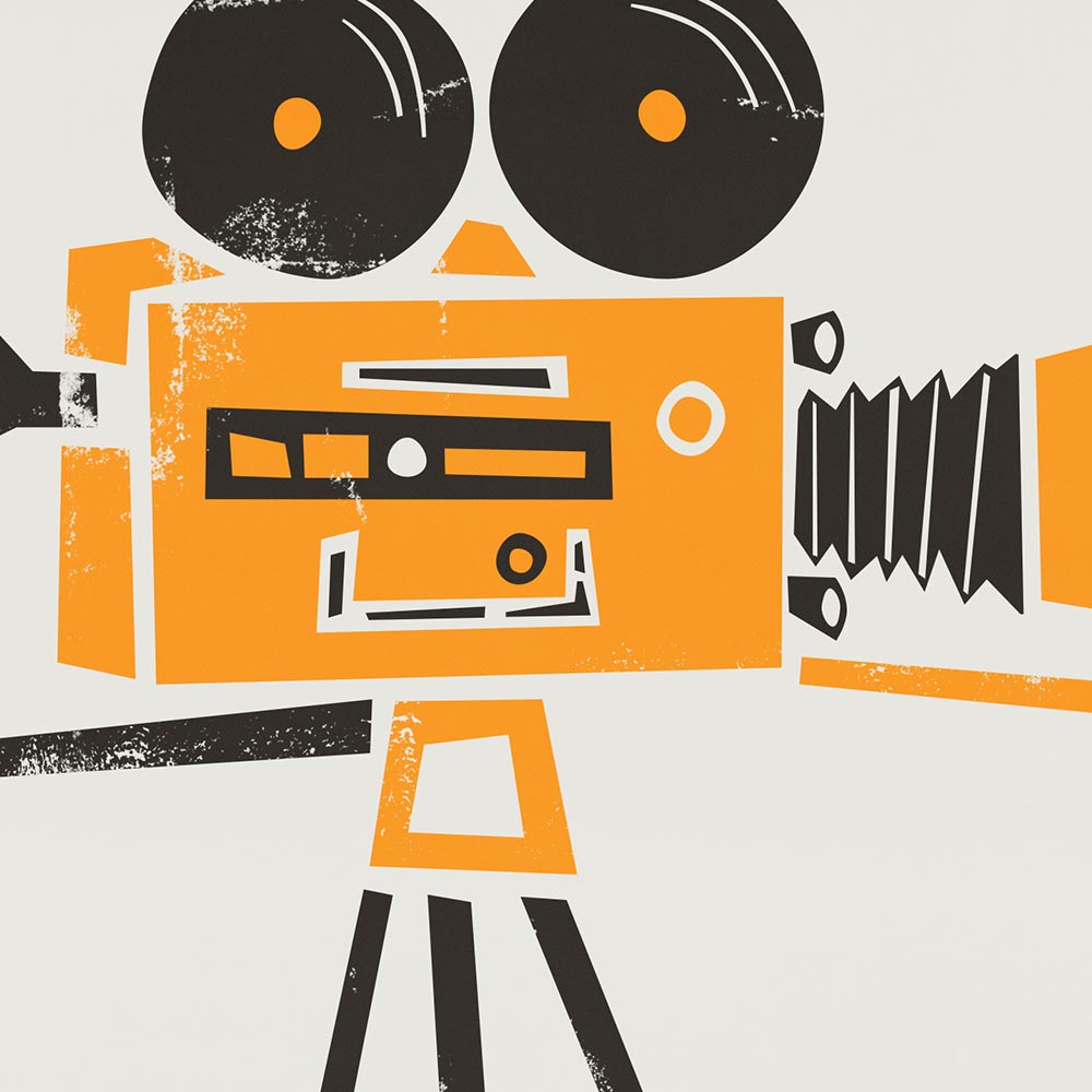 A close-up of the print showing the texture and fine details of the orange and black vintage movie camera illustration, highlighting its charming retro aesthetic.
