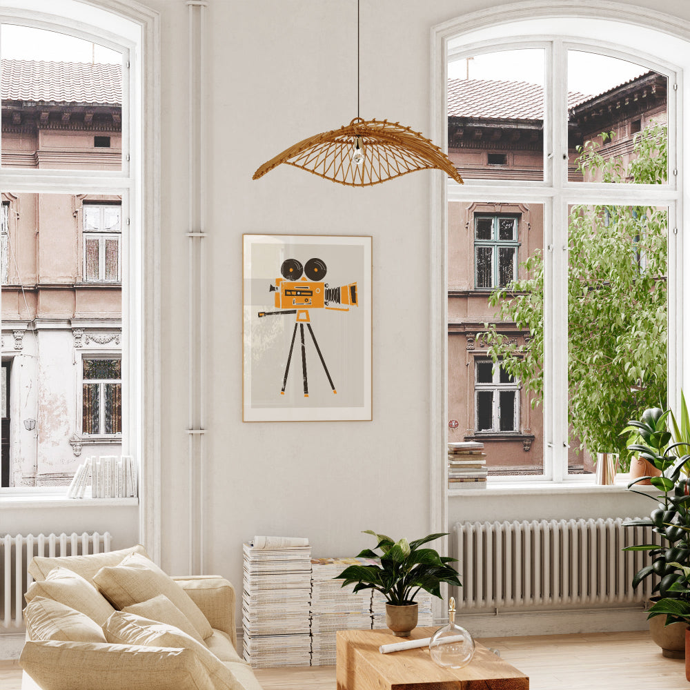 Framed film camera art print displayed in a bright, white room with soft natural light, bringing energy and creativity to the wall with its bold graphic style.
