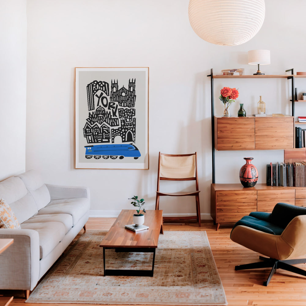 York city print framed above a bench in a retro-modern living space, paired with wood tones and soft lighting.