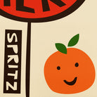 Close-up detail of a smiling orange and bold text design from the Spritz print.