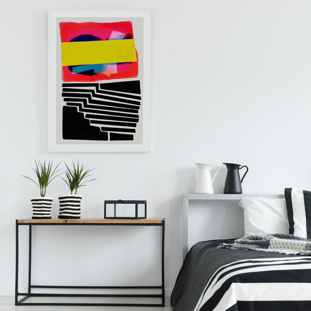 Colour block print framed above a minimalist console with monochrome decor — a pop of bold, structured energy.