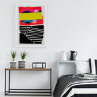 Colour block print framed above a minimalist console with monochrome decor — a pop of bold, structured energy.