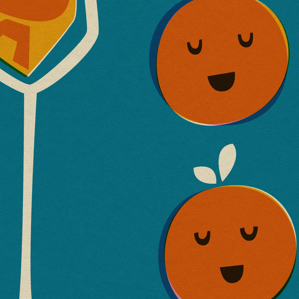 Close-up view showing the playful orange faces and the elegant stem of a champagne flute filled with bubbly orange text.